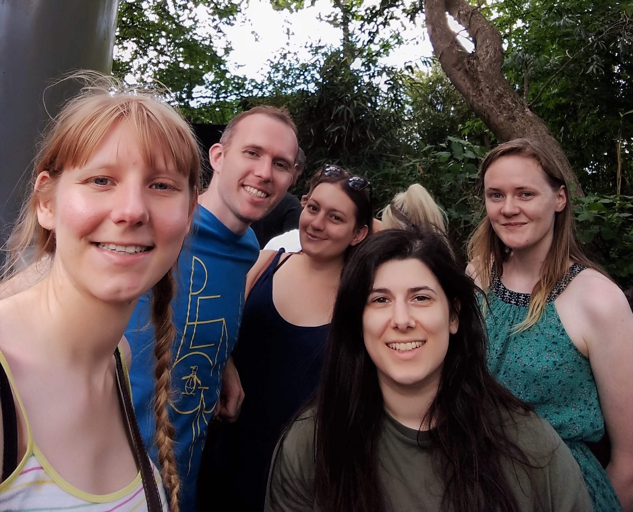 Kim, Greg, Lauren, Laura and Lucy standing in a queue line taking a selfie.