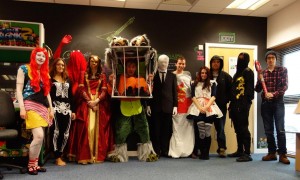 Everyone dressed up in Halloween costumes; costumes included Sally from Nightmare Before Christmas, a murderous lumberjack, a horror themed Alice in Wonderland, Slenderman, the housing market crash, a masquerade mask/gown and a skeleton.